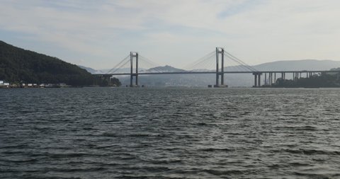 View of the ria de Vigo from a boat, with the bridge of Rande at the background