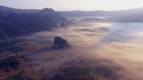Sunrise and morning mist at Pha Chang Noi Viewpoint, Phu Langka National Park, Phayao Province, Thailand.