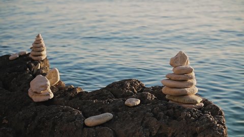 Zen stones on a ocean sea cliff.

