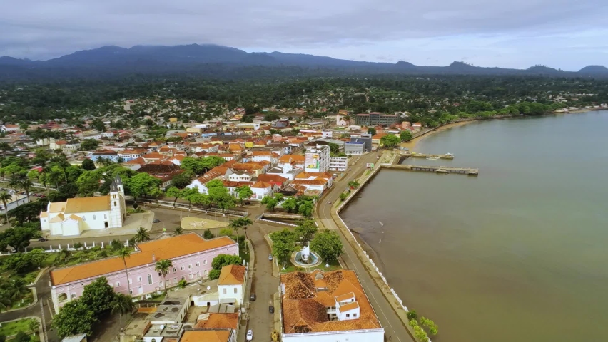 Aerial view over the coast of the Sao tome city, in sunny Africa - reverse, drone shot | Shutterstock HD Video #1080037190