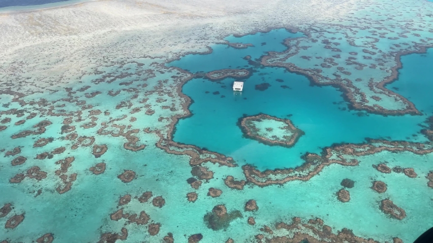 Aerial view of the Great Barrier Reef's Heart Shaped Reef. | Shutterstock HD Video #1080038309