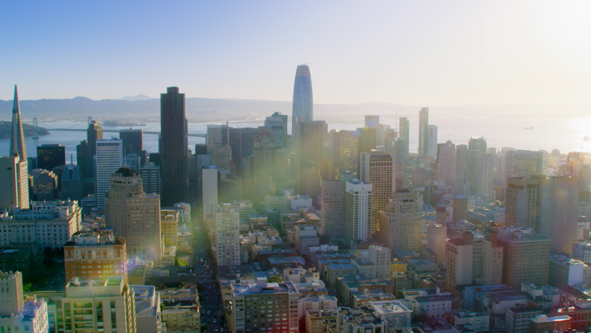 San Francisco Financial District aerial view. Famous skyscrapers and the Bay bridge. California, United States. 