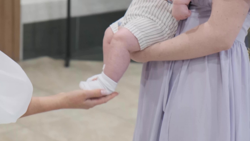 Mother holding baby in her arms