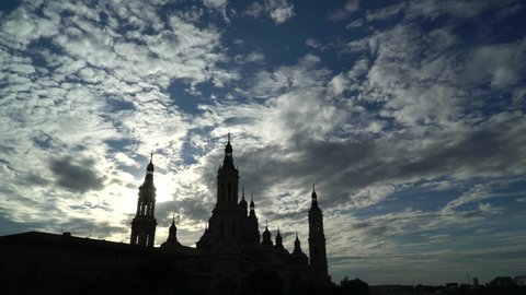 Backlighting of the cathedral-basilica of Nuestra Señora del Pilar in Zaragoza in the background. Zaragoza, City. Spain. Blue sky
