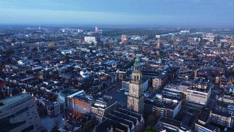 GRONINGEN, NETHERLANDS - 02. OCTOBER 2021: Aerial view of the Martinitoren Church Tower above Grote Markt and next to the Forum 