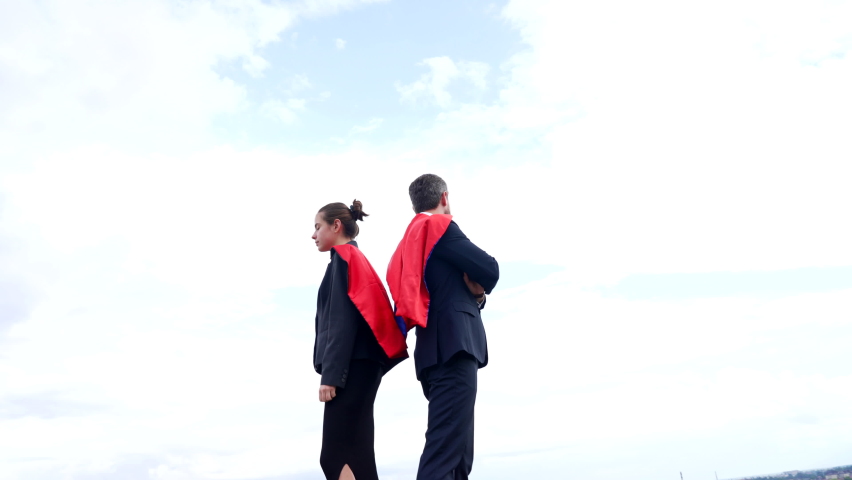 man and woman entrepreneur or leaders in super hero suit on sky background, successful business. Royalty-Free Stock Footage #1080048143
