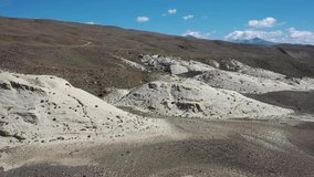 Aerial video from drone of Altai white clay landscape in Kosh-Agach highlands in the valley of Chagan-Uzun river. Because of its unusual appearance, this place is called the Moon. Altai, Russia.