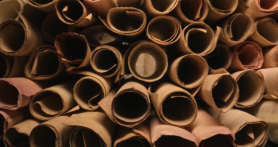 Ancient scrolls with futhpak symbols stacked on a pile. Ancient scribe library. View from inside. Parallax effect. Royalty-Free Stock Footage #1080062357