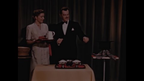 1950s: Magician waves fingers, cup appears inside hat. Magician makes glass of milk disappear.