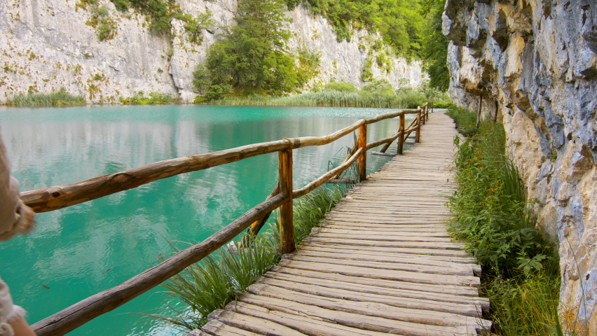 Young tourist walking by Plitvice Lakes