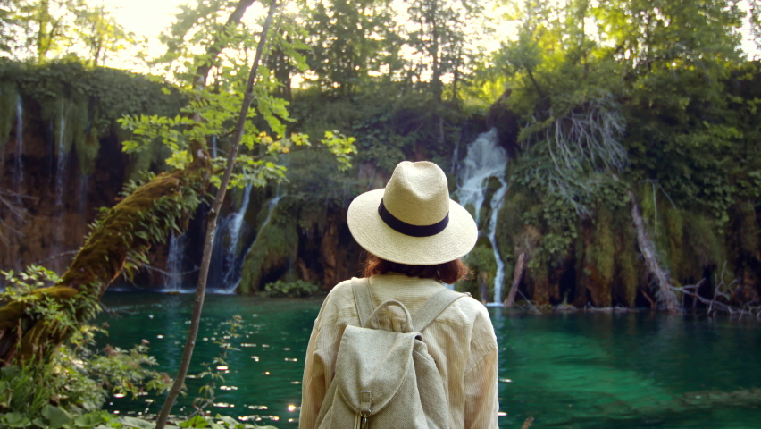 Young woman looking at waterfalls