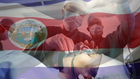 Animation of flag of costa rica waving over surgeons in operating theatre. global medicine, healthcare services during covid 19 pandemic concept digitally generated video.