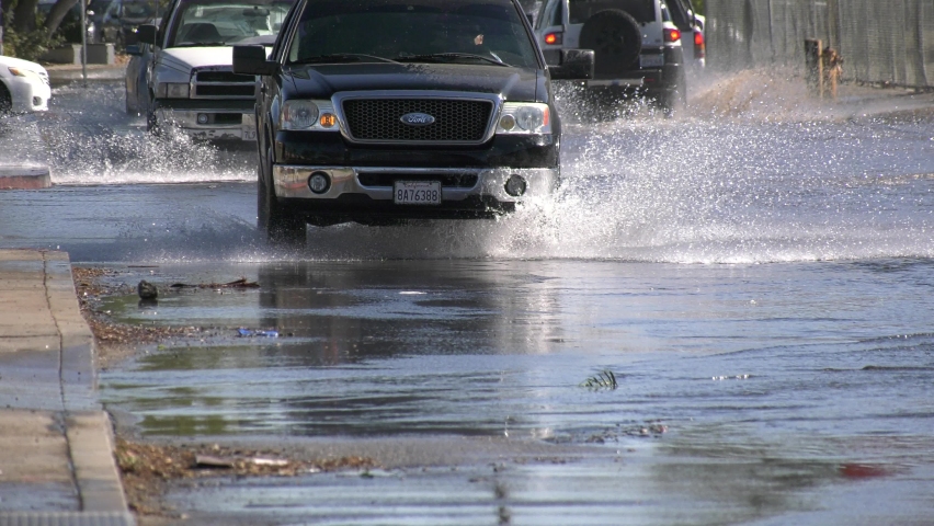 Los Angeles , United States - 09 29 2021: street flooding on busy la road