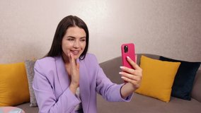 Enjoying social media life, break. Cheerful female blogger reading positive comments on smartphone device, modern smartphone gadget record young female speaker, coach making live broadcast on internet