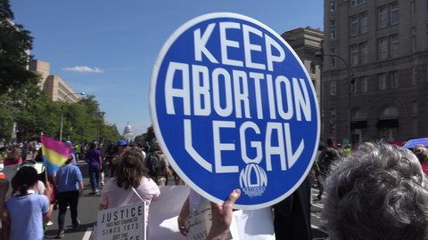WASHINGTON, DC – OCT. 2, 2021: After rally at Freedom Plaza, thousands march to Supreme Court, demanding continued access to abortion, at 2021 Women’s March in Washington, one of many across country.