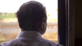 Man Looking out of Train Window. High quality video
