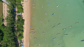 Amazing aerial Top view Longtail fishing boats in the tropical sea at Rawai beach Phuket Thailand Beautiful sea High quality video from drone camera