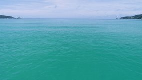 Aerial shot of open ocean sea surface Blue sky and horizon Amazing video from drone camera