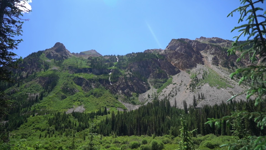 Heavenly Landscape of Rocky Mountains of Sunny Summer Day, Green Valley and Pond Under Hills, Tilt Down, Full Frame