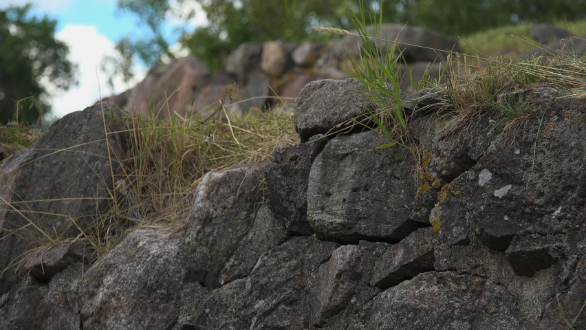 A close-up view of a boundary wall made of stone of a fortress.