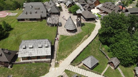 Drvengrad on Mecavnik Hill, Mokra Gora, Serbia. Drone Aerial View of Village WIth Wooden Houses in Green Summer Landscape