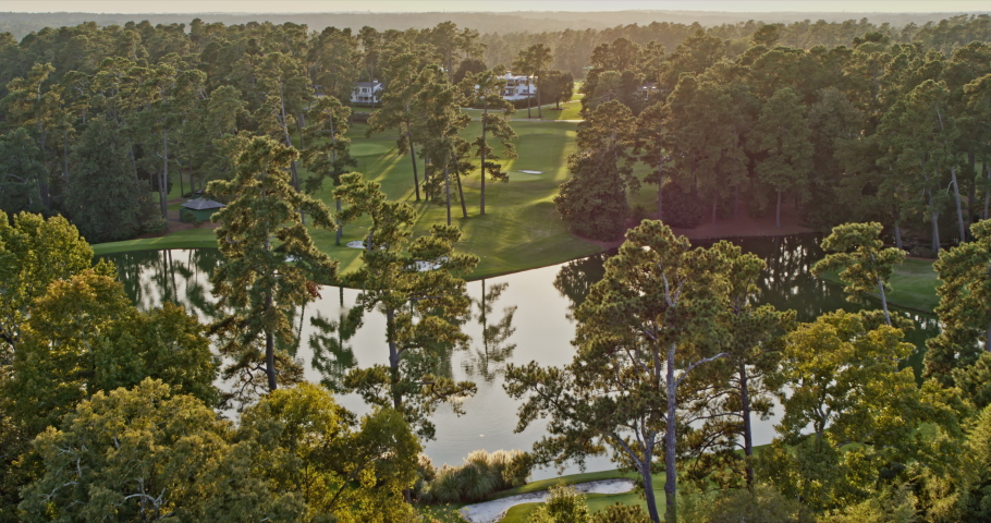 Augusta Georgia Aerial v20 cinematic low altitude flying across pristine and luxury national golf course at sunset golden hours - Shot with Inspire 2, X7 camera - October 2020 | Shutterstock HD Video #1080102980