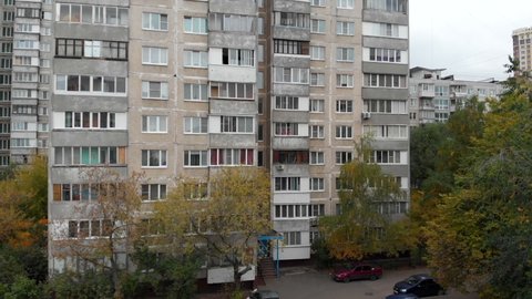 Flying up multi-storey soviet panel houses. Close up shot. High quality FullHD footage
