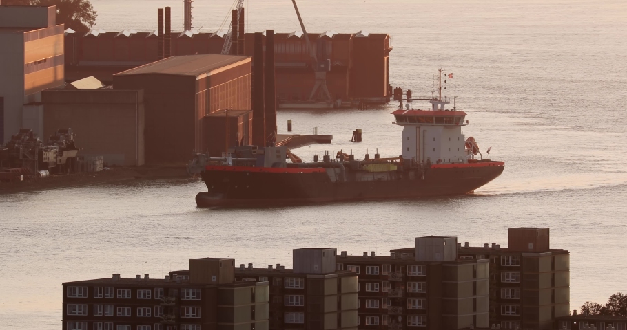 Tanker cargo ship arriving to the industrial harbor at Waalhaven, port of Rotterdam Royalty-Free Stock Footage #1080117125