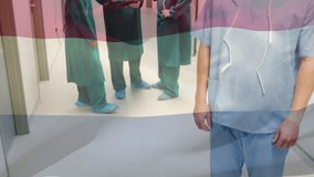 Animation of flag of netherlands waving over surgeons in operating theatre. global medicine, healthcare services during covid 19 pandemic concept digitally generated video.
