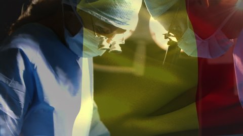 Animation of flag of belgium waving over surgeons in operating theatre. global medicine, healthcare services during covid 19 pandemic concept digitally generated video.