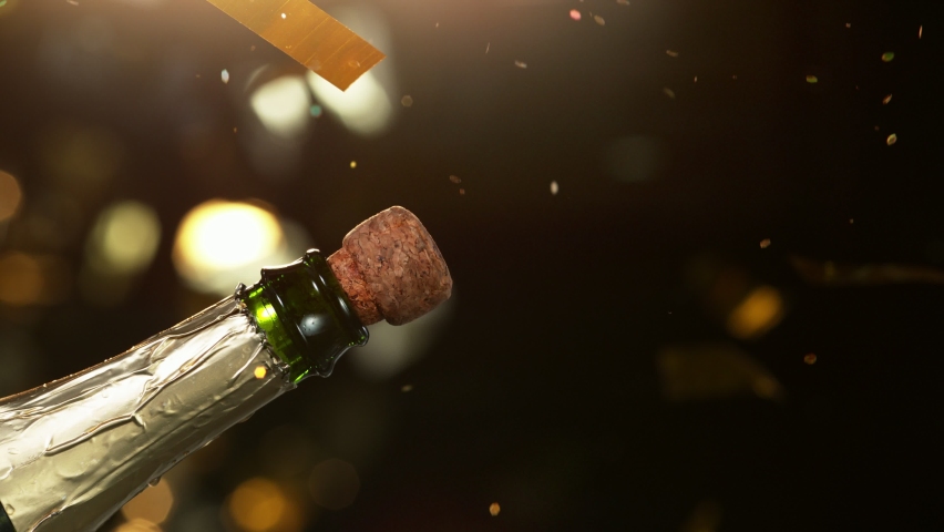 Super slow motion of Champagne explosion with glittering particles. Filmed on high speed cinema camera, 1000fps Royalty-Free Stock Footage #1080145055