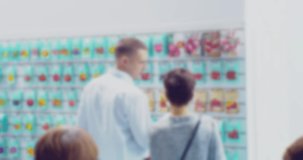 couple discussing goods in the store.blurry defocused video.