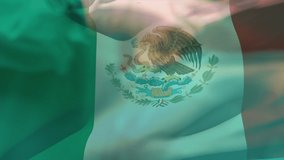Animation of flag of mexico waving over surgeons in operating theatre. global medicine, healthcare services during covid 19 pandemic concept digitally generated video. - Powered by Shutterstock - Get 15% off with code: PIKWIZARD15