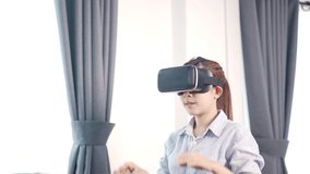 Asian Woman using VR headset in glasses of virtual reality technology VR experience Future technology concept.
