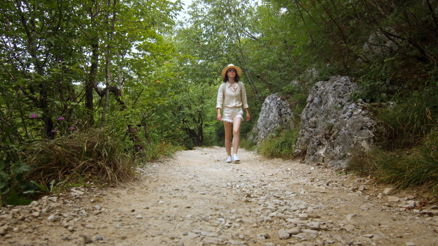 Young woman walking in Plitvice National Park