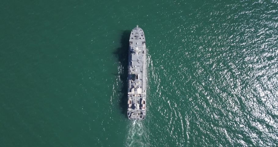 Aerial view of naval ship, battle ship, warship, Military ship resilient and armed with weapon systems, though armament on troop transports. support navy ship. Military sea transport.