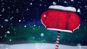 Snow falling over red wooden sign post on winter landscape against night sky. christmas festivity and celebration concept - Powered by Shutterstock - Get 15% off with code: PIKWIZARD15