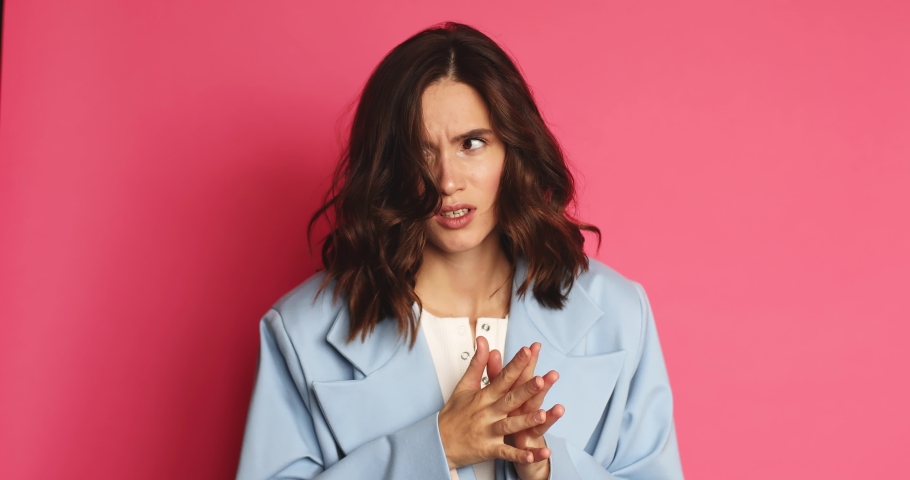 Need to think! Pensive doubting woman in jacket pondering and imagining in mind, wondering difficult solution, feeling confused, not sure about choice. Studio shot isolated on pink background. | Shutterstock HD Video #1080179204