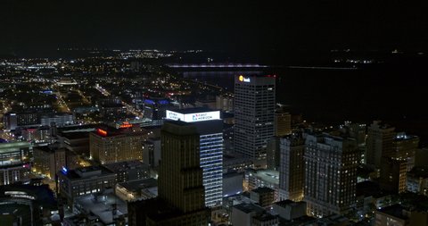 Memphis Tennessee Aerial v2 circular pan shot, first horizon bank building facade displaying red heart shape led light in downtown at night - Shot with Inspire 2, X7 camera - August 2020