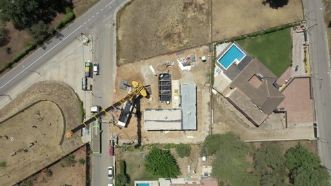 Top View Of Modern Modular House Construction Site With Swimming Pool. drone rotate