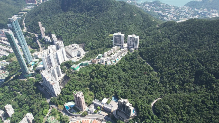 City Aerial in Hong Kong Island 4K Aerial shot of the premium residential area at mid-level and the central financial business along the sides of the Victoria Harbour