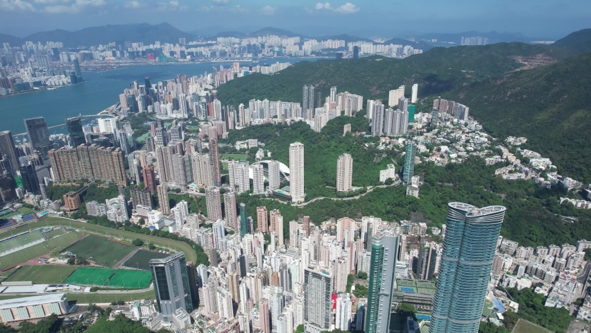 City Aerial in Hong Kong Island 4K Aerial shot of the premium residential area at mid-level and the central financial business along the sides of the Victoria Harbour