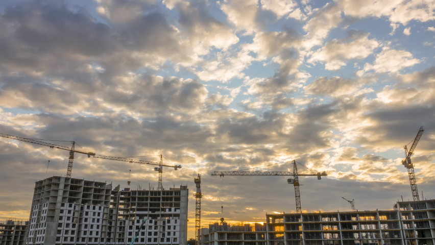 Construction Site Cranes and Dusk. Time Lapse