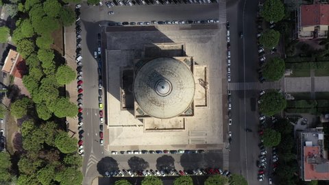 The basilica of Saints Peter and Paul in the Eur district of Rome.
Spectacular aerial shot with drone around the dome with a view over the whole Eur district