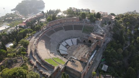 Amazing Aerial drone shot of Greek theatre Taormina, Sicily, Italy taken on sunny day 2021