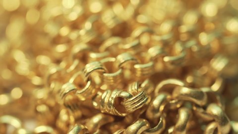 Closeup shot of gold necklaces with rotating
