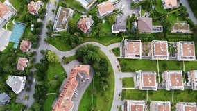 Aerial top down drone footage of the Jura area mixing ancient and modern residential buildings in Fribourg city, Switzerland