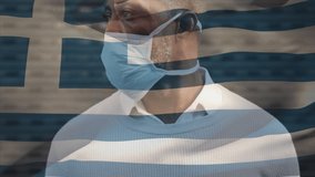 Animation of flag of greece waving over man wearing face mask during covid 19 pandemic. global covid 19 pandemic concept digitally generated video.