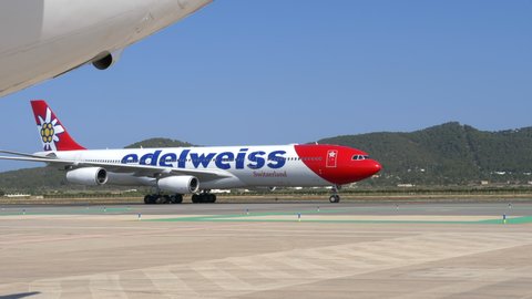 Ibiza , Spain - 07 21 2021: Giant jet airplane Airbus A340 from Edelweiss taxiing to the terminal