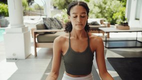 Mixed race female teen practicing meditation outside home feeling fresh 